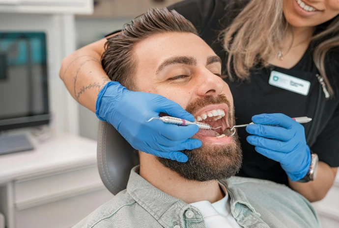 a person brushing a person's teeth